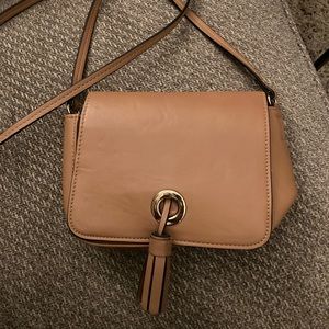 Tan and gold cross body purse with tassel